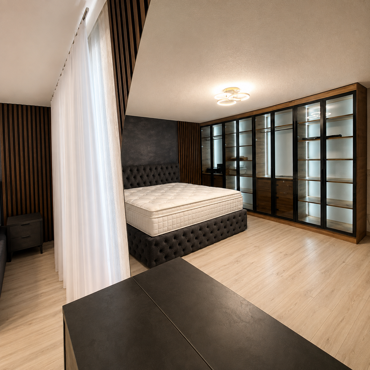 Suite Milano anthracite avec lit capitonné et dressing vitré